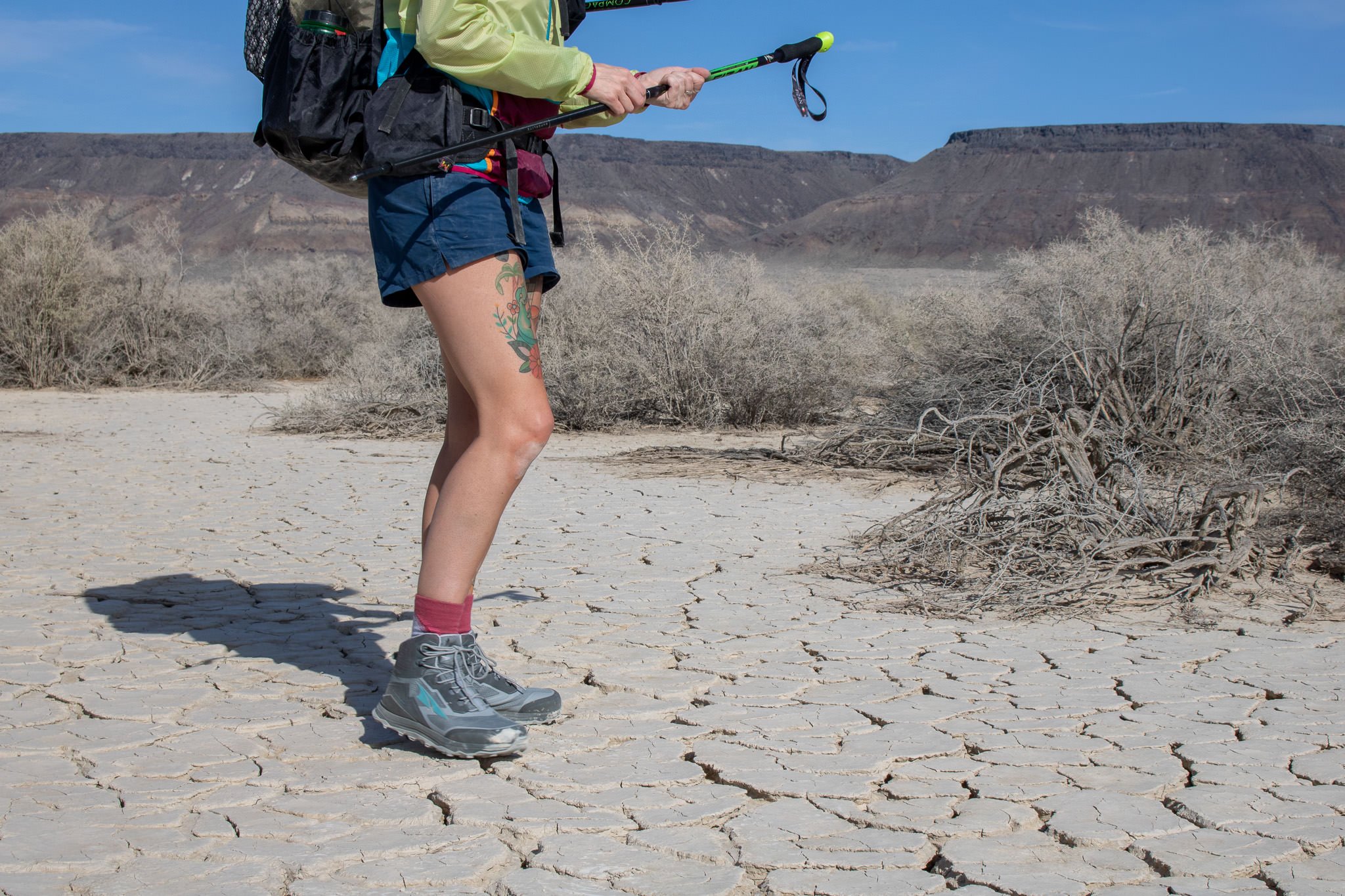 Closeup of a backpacker's lower half in the Patagonia Barely Baggies Shorts