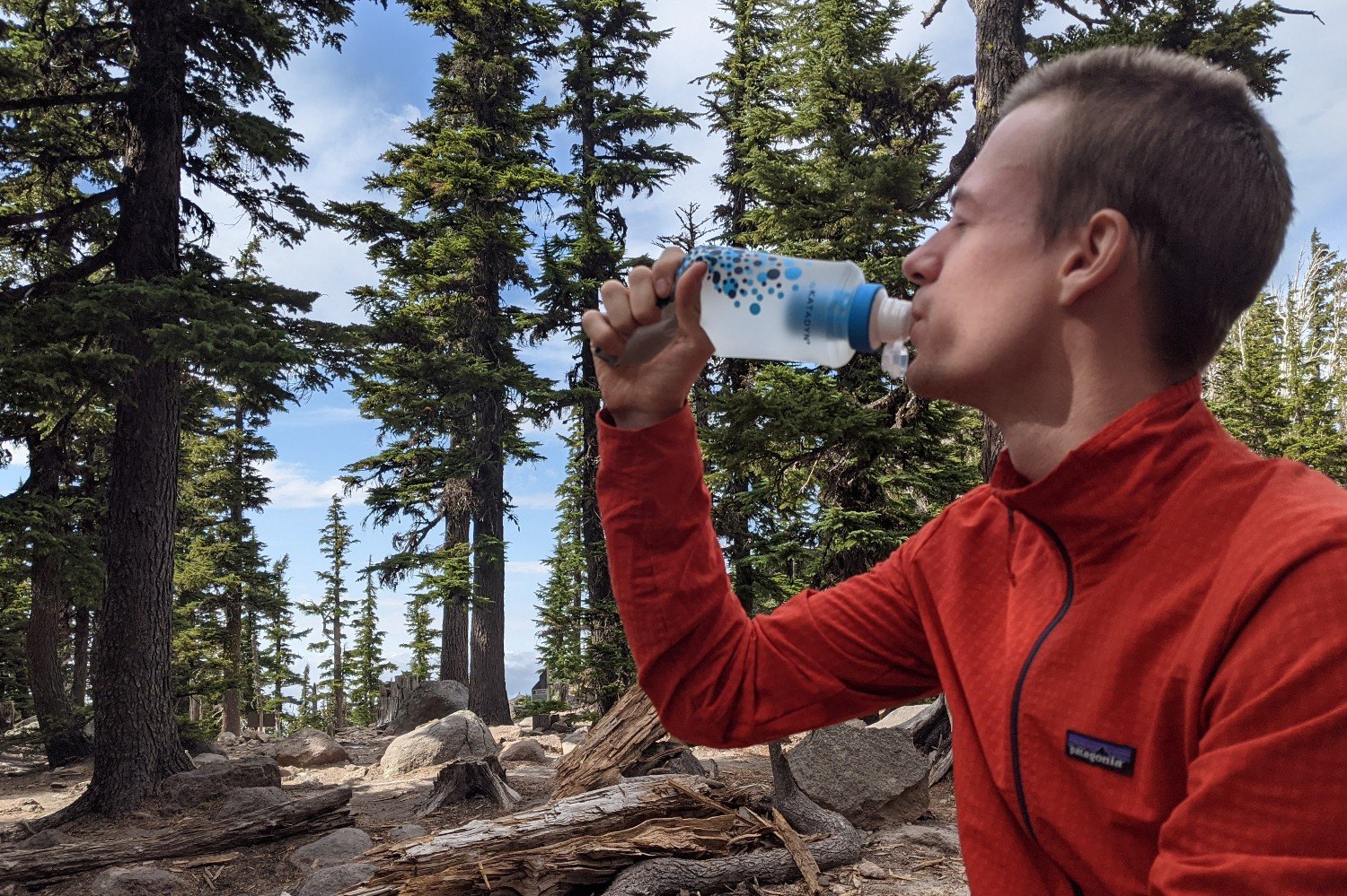 A hiker drinking from the Katadyn BeFree water filter