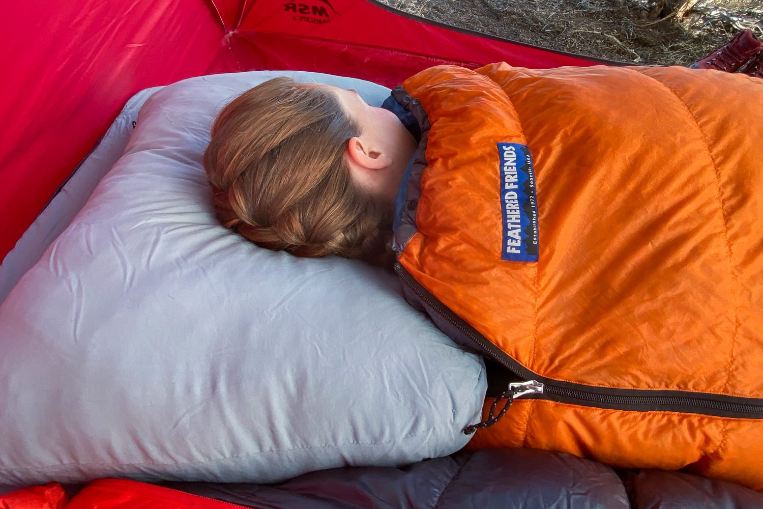 A camper using the HEST Standard Pillow