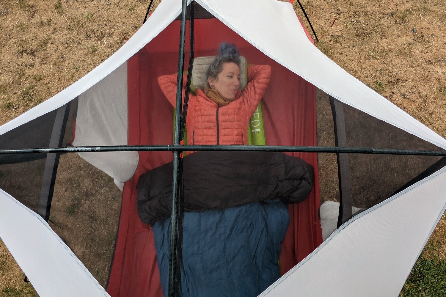 Top-down view of a backpacker using the Sea to Summit Aeros Down pillow