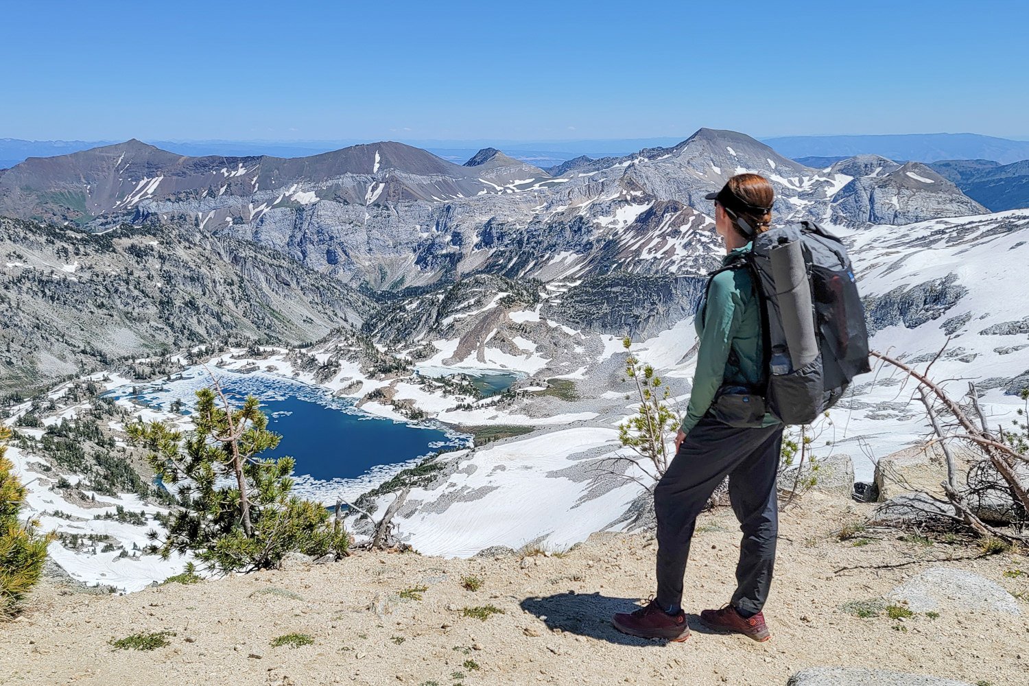 A backpacker wearing the Mountain Hardwear Trail Sender Pants in the Eagle Cap Wilderness