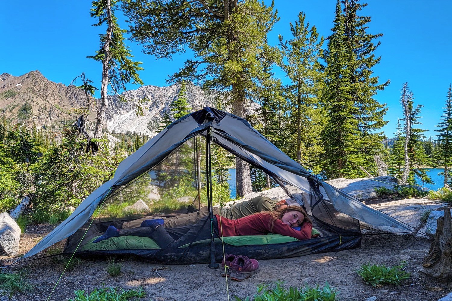 Backpackers relaxing in their tent on their sleeping pads