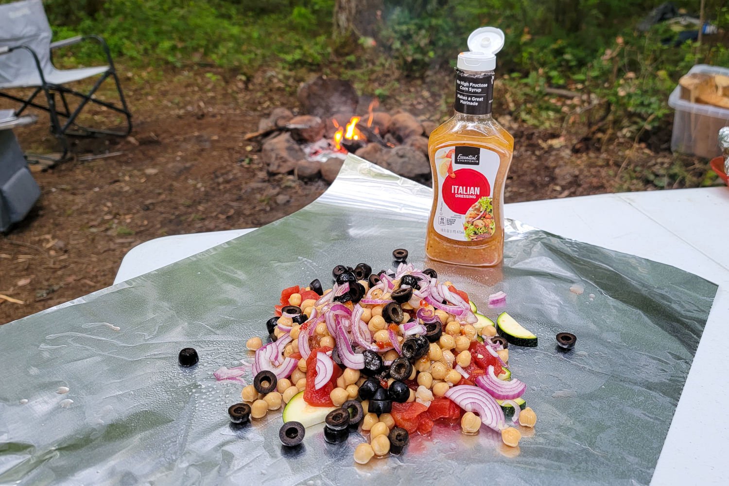 The ingredients for the greek chickpeas foil packet meal ready to be doused with italian dressing and folded up for cooking