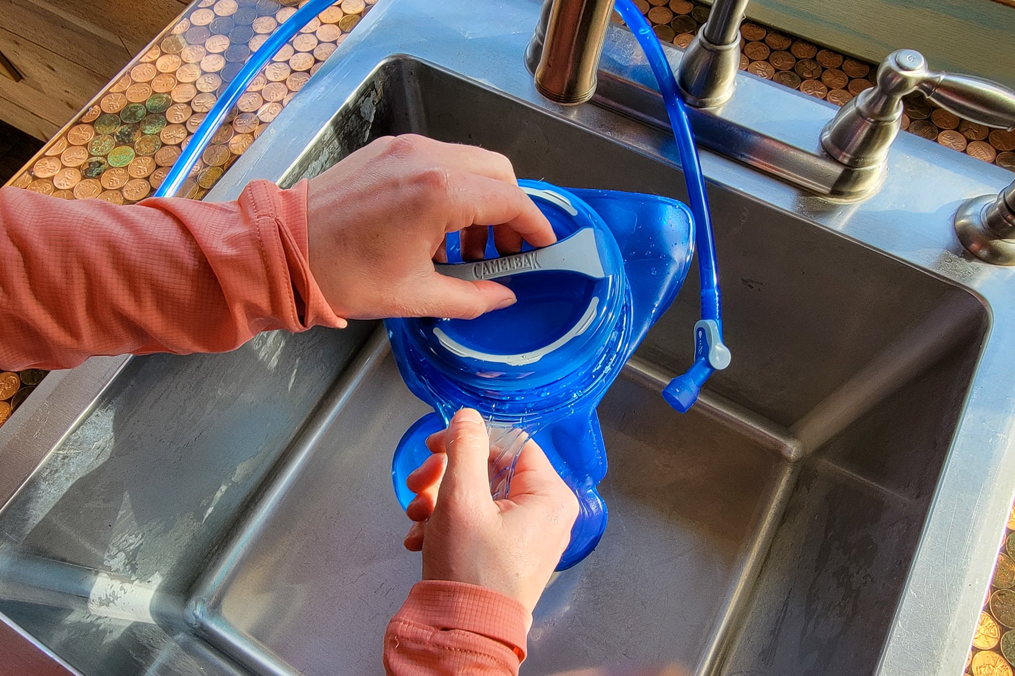 Closeup of the CamelBak Crux hydration pack in a sink