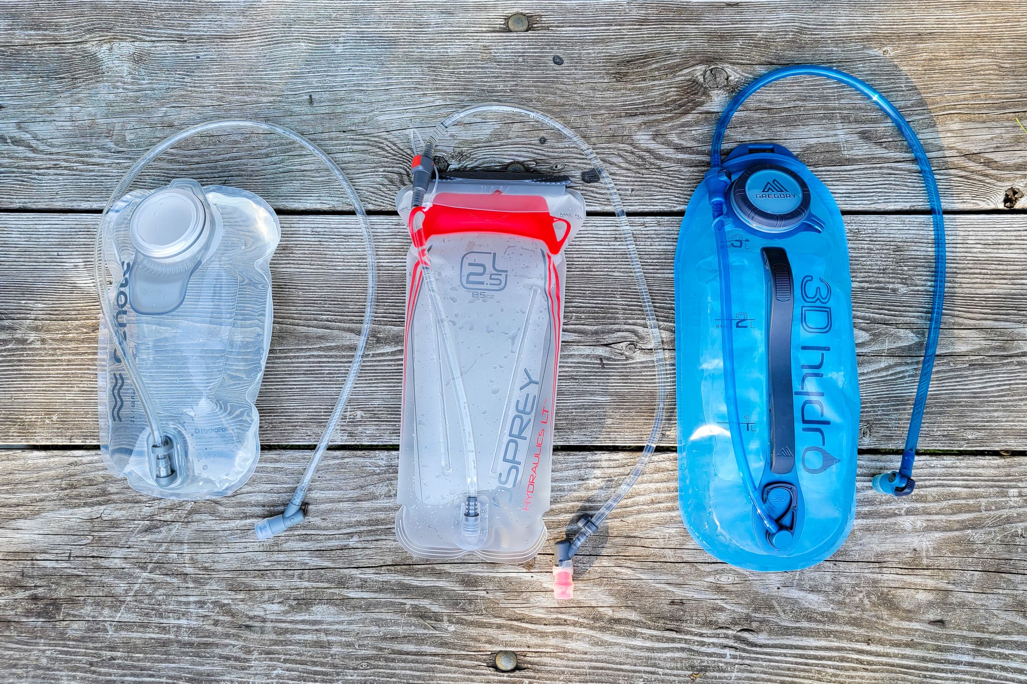 Top-down view of the HydraPak Cenote 2L (left), Osprey hydraulics LT 2.5L (middle) & Gregory 3D Hydro 3L (right)