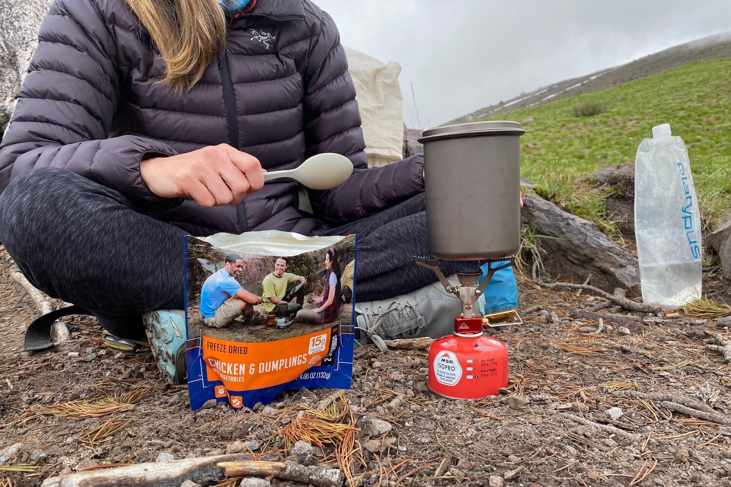 Using the MSR PocketRocket 2 to boil water for a freeze-dried meal.