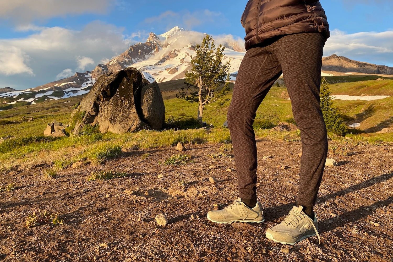 Closeup of a backpacker wearing the IUGA Fleece Lined in front of Mt. Hood