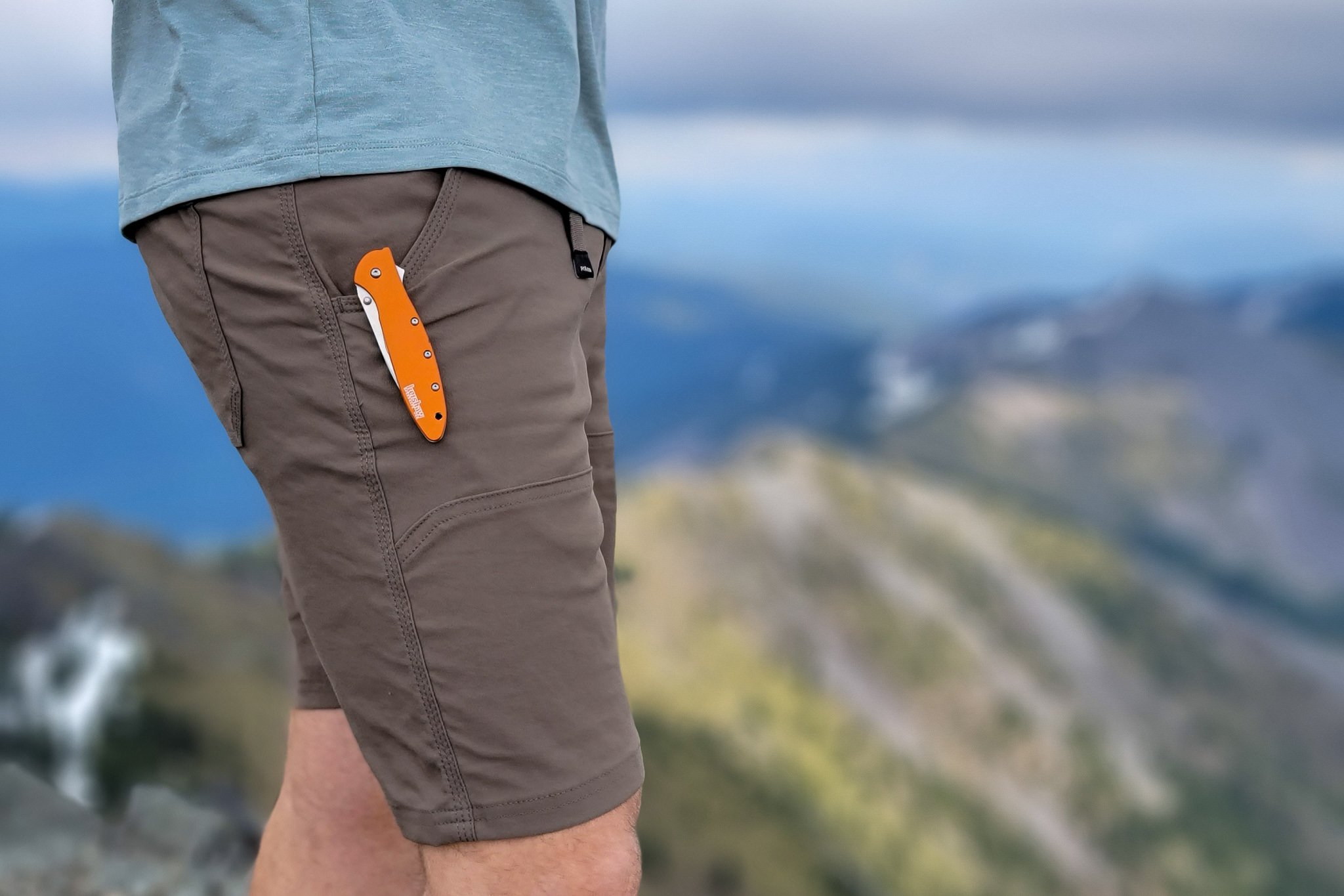 A close up of a pocket knife in the leg pocket of the Prana Stretch Zion II shorts