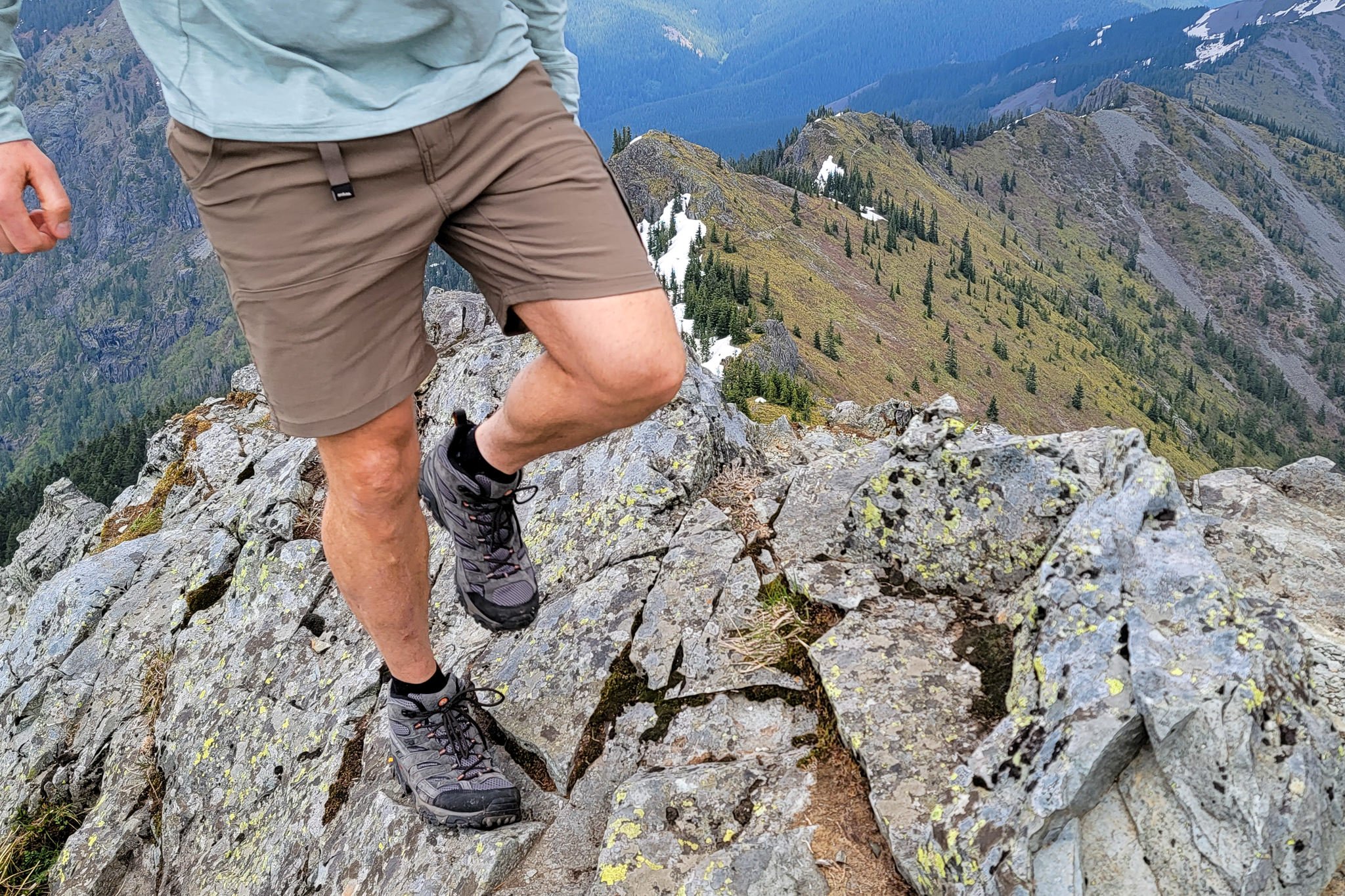 A waist down view of a hiker in Prana Stretch Zion Shorts walking up a ridge