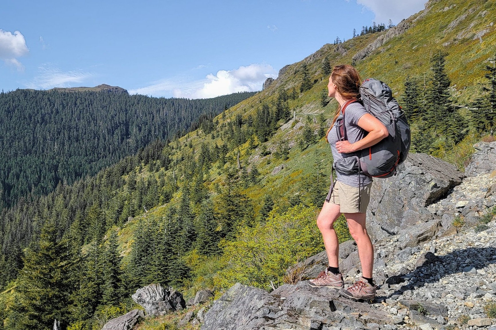 A backpacker wearing the Columbia Sandy River Cargo Shorts