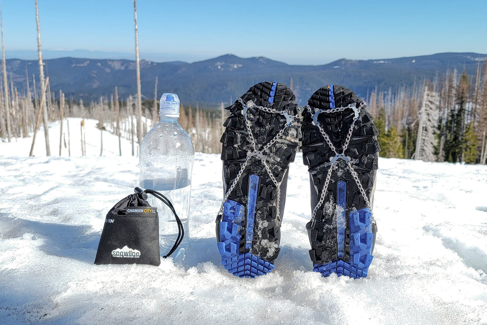 Closeup of the Snowline Chainsen City and their stuffsack with a water bottle for a sense of the size