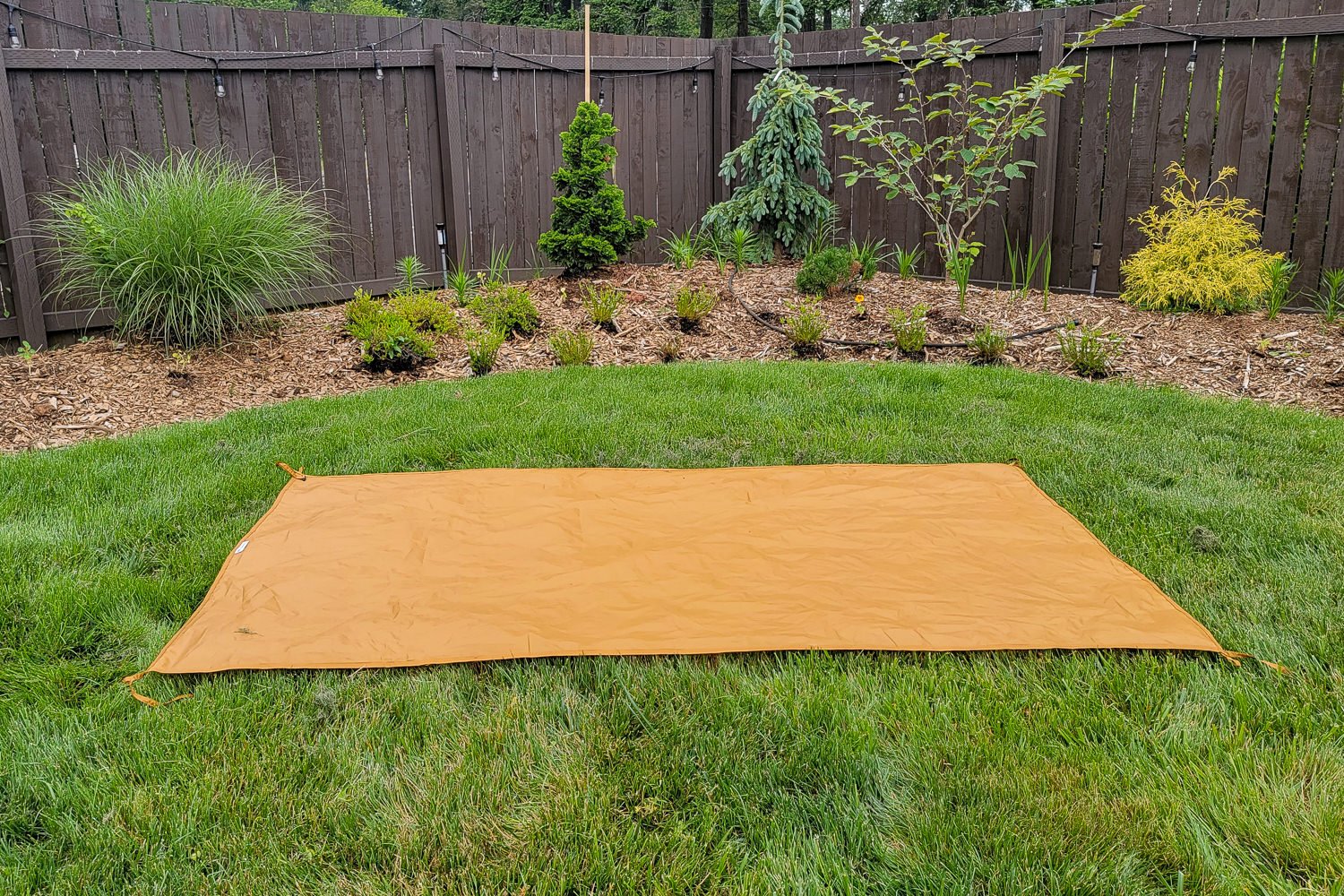 The footprint of the Trailmade 2 tent lying on the grass