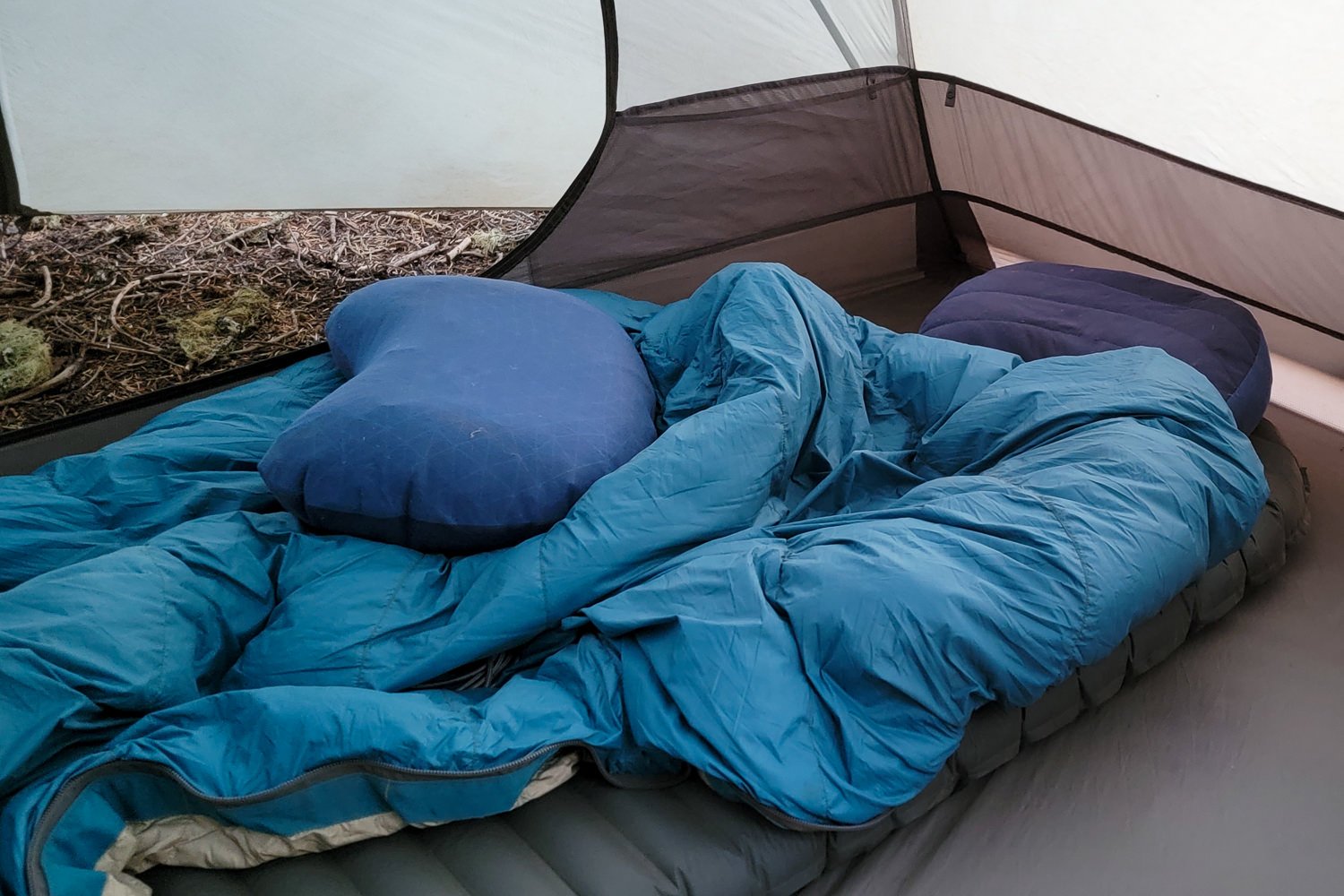 A backpacking tent with two Aeros Pillows