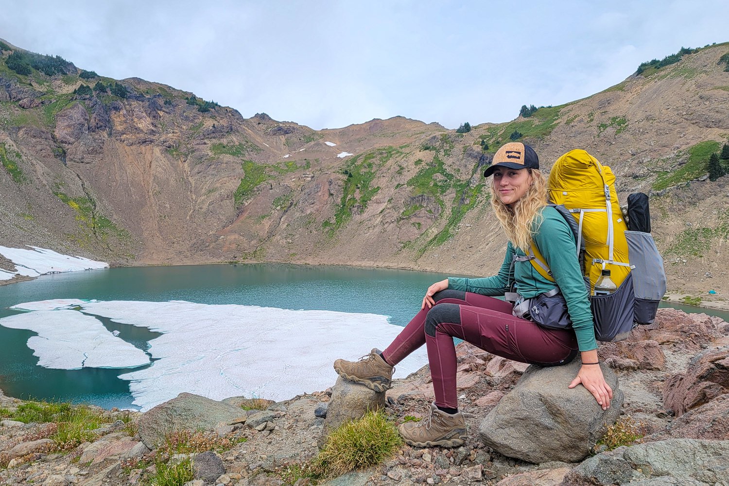 A hiker walking on a foggy trail in Fjallraven Abisko Trekking Tights